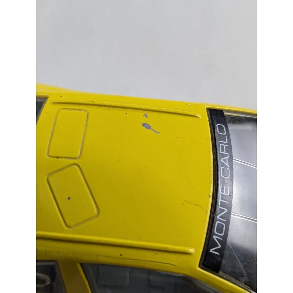 1996 Racing Champions Chevrolet BriCkyard 400 1:64 Monte Carlo Car Yellow